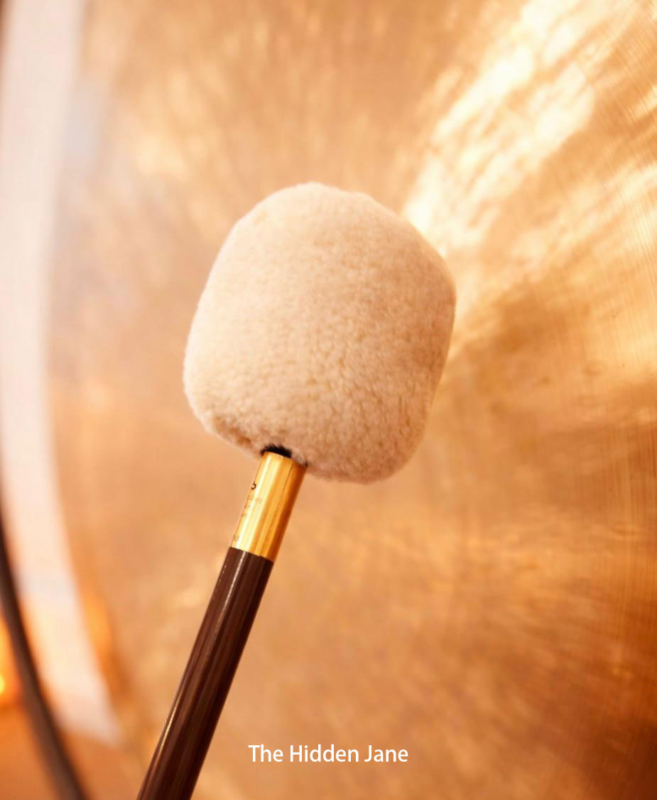 Singing bowl and mallet for sound therapy session at The Hidden Jane